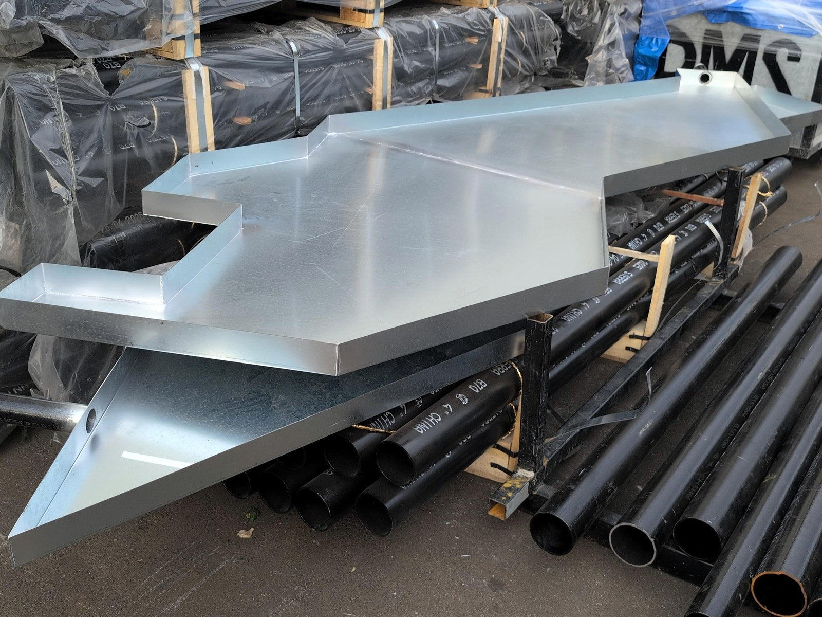 Custom galvanized drain pan with welded corners and stepped footprint, fabricated by Taylor Metals in Pitt Meadows BC