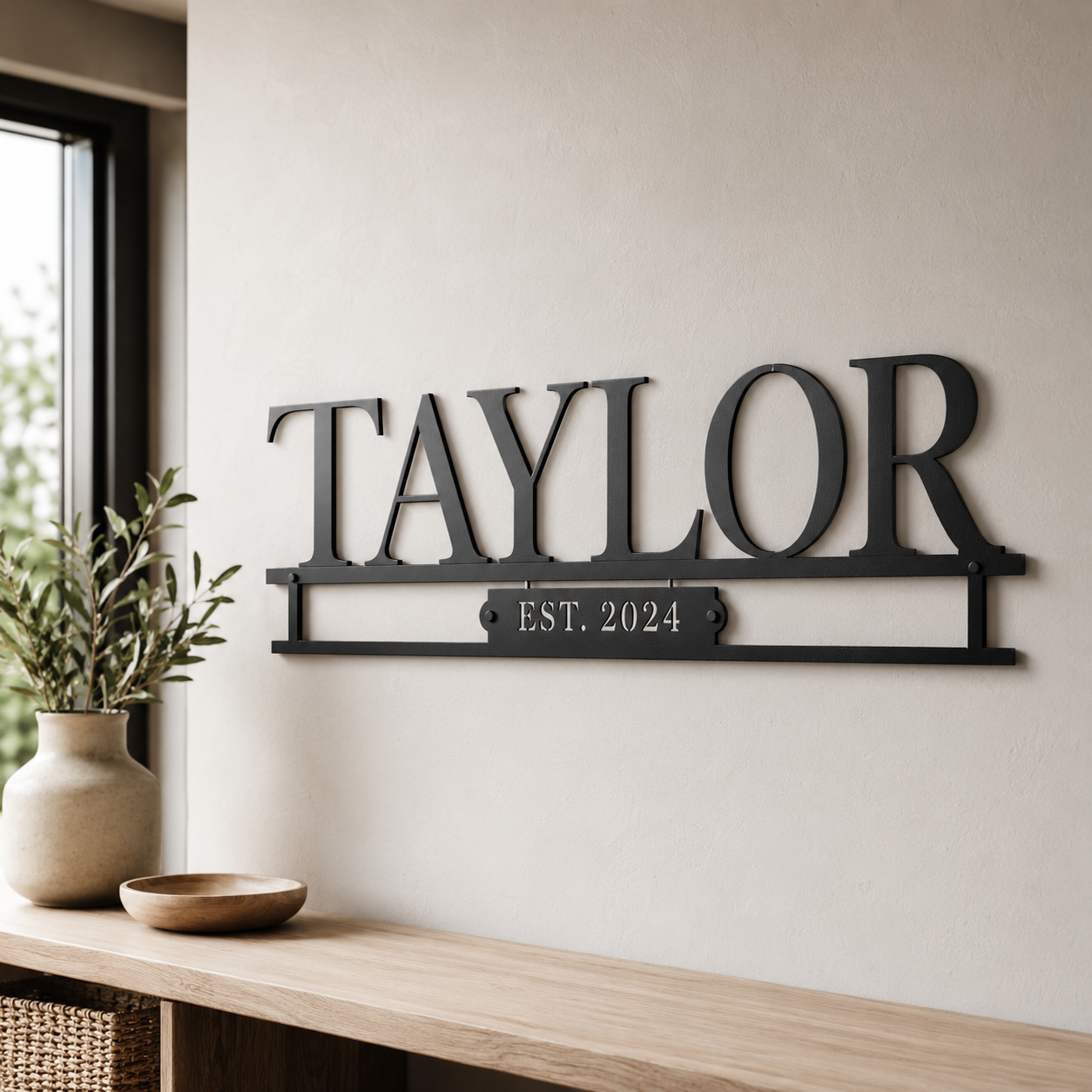 Personalized laser-cut metal family name and monogram wall art by Taylor Metals